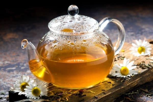 chamomile tea in a glass pot